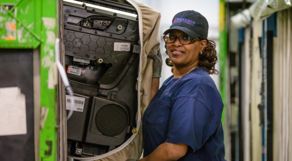 Woman working in an auto factory
